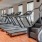 The fitness center at our apartments for rent in Grapevine, featuring treadmills, stair steppers, and spin bikes.