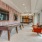 Resident lounge at our apartments for rent in Grapevine, TX, featuring tiled flooring, couches, and a shuffleboard table.