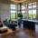 Resident lounge at our apartments for rent in Grapevine, TX, featuring tiled flooring, couches, and a balcony with a view.