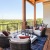 Outdoor lounge on the balcony at our apartments for rent in Grapevine, TX, featuring outdoor couches and tables.