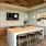 Resident lounge at our apartments for rent in Grapevine, TX, featuring tiled flooring and counter seating.